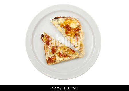 Buttered toast with marmalade on a plate isolated against white Stock Photo