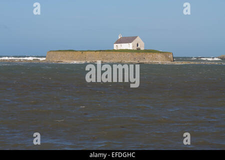 Looking out to see at high tide at St Cwyfan’s Church, the Church in the Sea. Llangwyfan, Aberffraw, Anglesey, Wales, United Kin Stock Photo