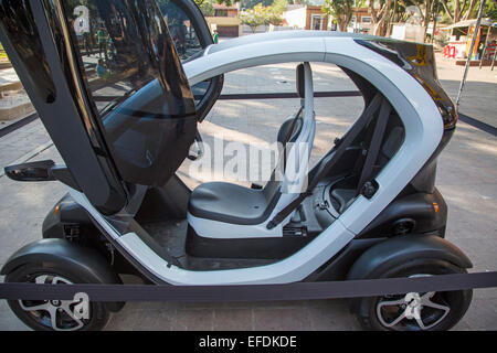 Oaxaca, Mexico - Renault's Twizzy, a battery-powered two-passenger electric car, on display in El Llano park. Stock Photo