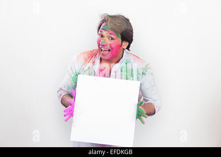 1 indian man holi Festival Showing Message Board Stock Photo