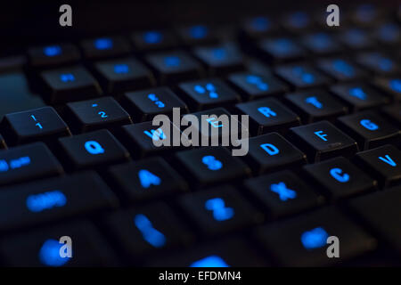 Blue back lit gaming keyboard wasd Stock Photo