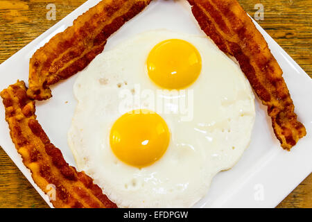 Bacon  and eggs on a white plate Stock Photo