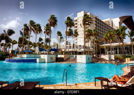 People Relaxing at Poolside, Caribe Hilton, San Juan, Puerto Rico. Stock Photo