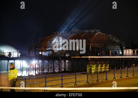 Night scene of the remains of Eastbourne Pier after a fire broke out in the arcade on July 30, 2014  Where: Eastbourne, United Kingdom When: 31 Jul 2014 Stock Photo