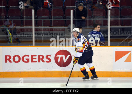 Toronto, Canada. 1st February, 2015. Connor McDavid of the Erie Otters in the warm-up before their Ontario Hockey League (junior) game with Ottawa 67s skates by two fans with Toronto Maple Leafs jerseys with his name on the back.  McDavid is the top rated prospect for the upcoming NHL draft and is coveted by many teams, including the Leafs who are currently on a downward spiral. Credit:  Paul McKinnon/Alamy Live News Stock Photo
