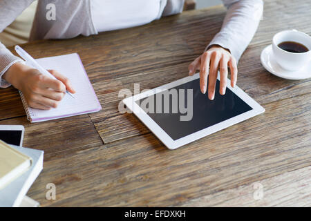 Young woman studying in cafe Stock Photo