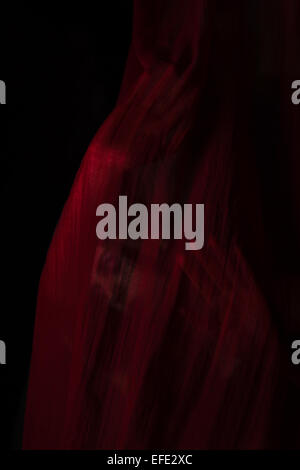 Girl posing with red cloth. Concept, abstraction Stock Photo