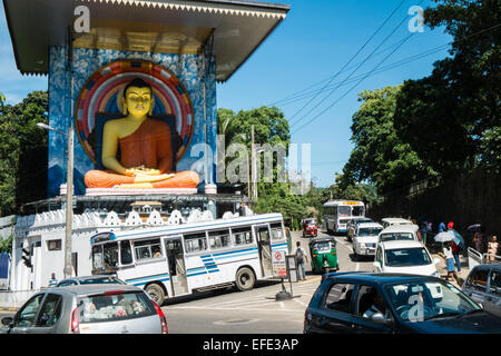 Huge sitting Buddha statue with large roof near train station, in city centre,Kandy,Sri Lanka,traffic, Stock Photo