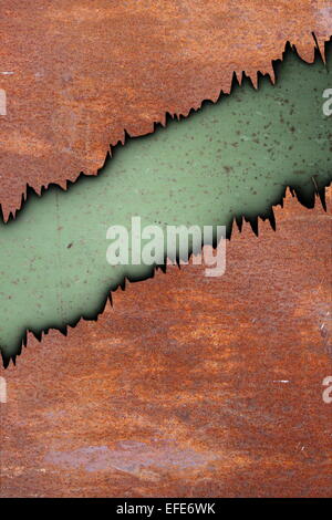metal rust texture with cracks over old green painted surface Stock Photo