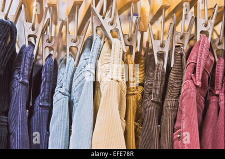 Colorful corduroy trousers in a store Stock Photo