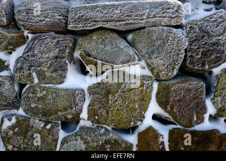 Winter frost on Hadrians Wall looking west over Cawfields Crags near ...