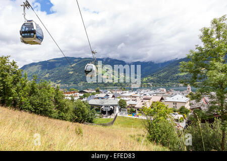 The cable car going up to the Mittelstation on the Schmittenhöhe Zell am See Austria in summer with a view of the lake Stock Photo