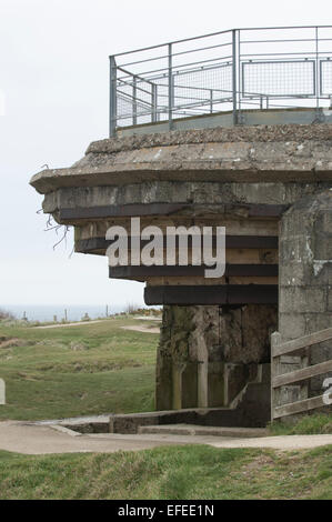 Battered German gun emplacement on the Normandy beach defenses, damaged by Allied invasion forces on D-Day Stock Photo