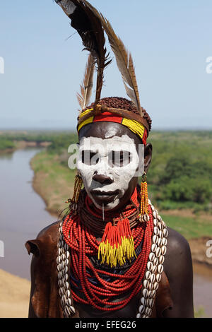 TURMI, ETHIOPIA - NOVEMBER 19, 2014: Karo people with traditional paintings on November 19, 2014 in Turmi, Ethiopia. Stock Photo