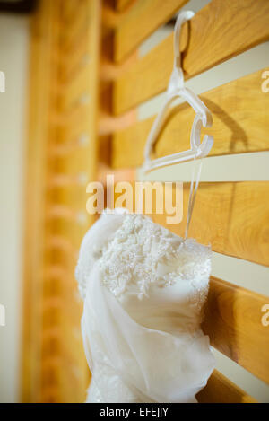 Wedding dress hanging up Stock Photo