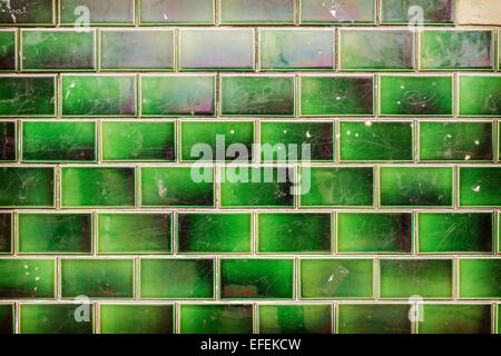 Green grungy tile wall background or texture. Stock Photo