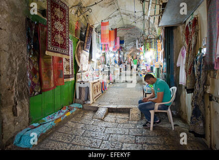 All kinds of shops in one of the small streets in the old city of Jerusalem Stock Photo