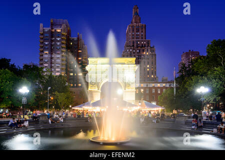 Crowds enjoy a summer night in Washington Square Park. Stock Photo