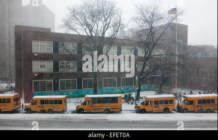 Students are discharged from Public School 33 in the Chelsea neighborhood of New York on Monday, January 26, 2015. Schools will close tomorrow, vehicles are banned after 11PM, commuter rails and buses will go to reduced service and eventually shut down as a massive blizzard approaches the Northeast which will drop up to two feet of snow in the city. (© Richard B. Levine) Stock Photo