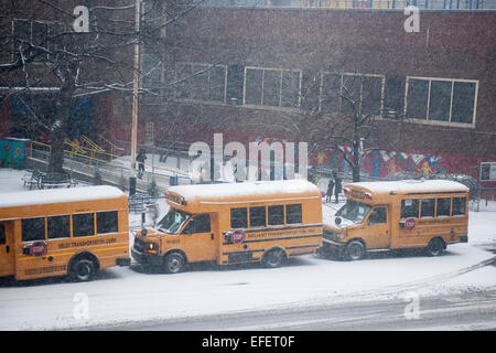 Students are discharged from Public School 33 in the Chelsea neighborhood of New York on Monday, January 26, 2015. Schools will close tomorrow, vehicles are banned after 11PM, commuter rails and buses will go to reduced service and eventually shut down as a massive blizzard approaches the Northeast which will drop up to two feet of snow in the city. (© Richard B. Levine) Stock Photo