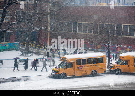 Students are discharged from Public School 33 in the Chelsea neighborhood of New York on Monday, January 26, 2015. Schools will close tomorrow, vehicles are banned after 11PM, commuter rails and buses will go to reduced service and eventually shut down as a massive blizzard approaches the Northeast which will drop up to two feet of snow in the city. (© Richard B. Levine) Stock Photo