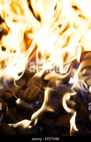 Grill with coals on fire with flames. Close up shot Stock Photo