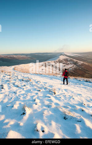 A walker at The Great Ridge in Winter, Mam Tor, Peak District National Park, Derbyshire Stock Photo