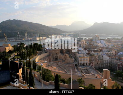 Millennia  old  Roman Theatre  (Teatro romano) in Cartagena,  Spain, seen from Parque Torres hill, harbour in the background Stock Photo