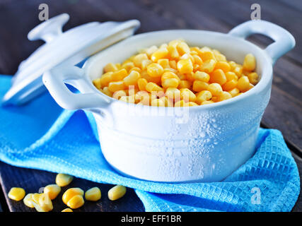 sweet corn in bowl and on a table Stock Photo