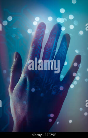 Hand touching virtual circuit board in the background. Cyberpunk, toned image. Stock Photo