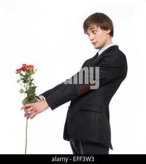 young man with flowers in suit isolated on white Stock Photo