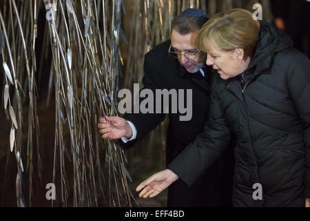 Budapest. 2nd Feb, 2015. German Chancellor Angela Merkel (R) pays tribute to the Holocaust victims at the Emanuel Memorial Tree in the Dohany Street Synagogue's yard in Budapest Feb. 2, 2015. The Emanuel Memorial Tree is a sculpture of weeping willow tree carrying the names of the hundreds of thousands of Jewish Hungarians murdered by the Nazis. Angela Merkel paid a day-long visit to Hungary on Monday. © Attila Volgyi/Xinhua/Alamy Live News Stock Photo