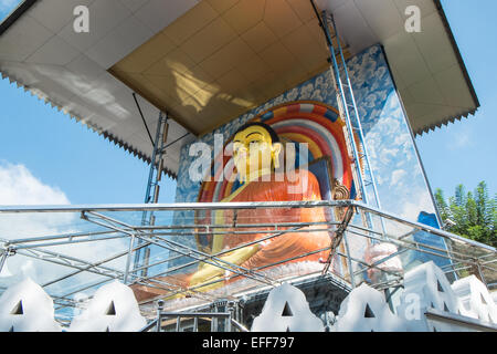 Huge sitting Buddha statue with large roof near train station, in city centre,Kandy,Sri Lanka, Stock Photo