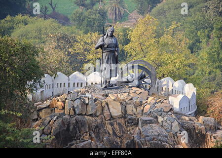 Statue of soldier holding spear standing near cannon on hillock near Pratap Smarak, Udaipur, Rajasthan, India, Asia Stock Photo