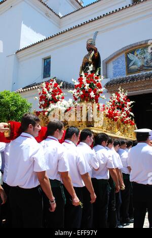 Statue of Saint Bernard on the float being carried into the church at the Romeria San Bernabe, Marbella, Costa del Sol, Spain. Stock Photo