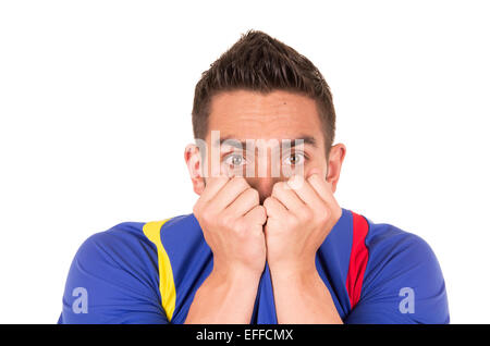 nervous soccer fan wearing blue tshirt watching game Stock Photo