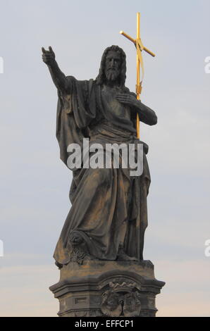 Saint John the Baptist statue in Charles bridge, Prague Stock Photo