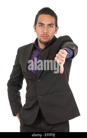 Elegant confident latin man in a suit gesturing defeat holding thumb down Stock Photo