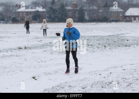 South London, UK. 03rd Feb, 2015. Picture shows an early morning jogger on Wimbledon Common in Southwest London, where there has been snow showers across parts of London. Credit:  Jeff Gilbert/Alamy Live News Stock Photo