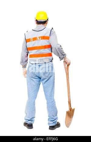 Back view of asian construction worker holding under construction signs ...