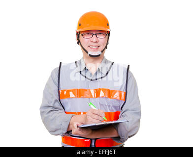 smiling asian worker writing on the clipboard Stock Photo