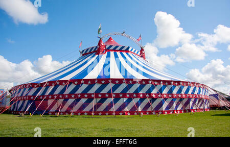 Uncle Sam's Great American Circus big top in a green field with a blue sky. Stock Photo