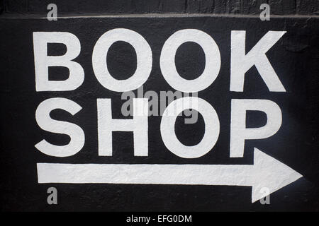 Book Shop sign white writing on black background with white arrow below pointing to right Newcastle NSW Australia Stock Photo