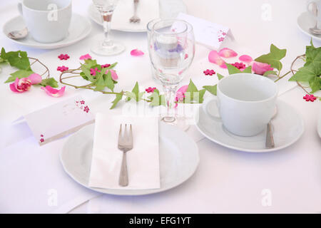 Solemnly laid table for a wedding with white and pink Stock Photo