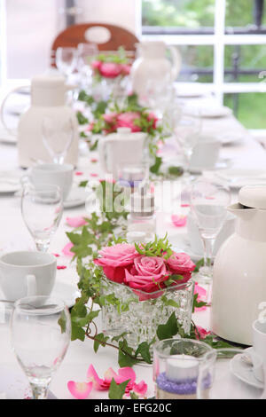 Solemnly laid table for a wedding with white and pink Stock Photo