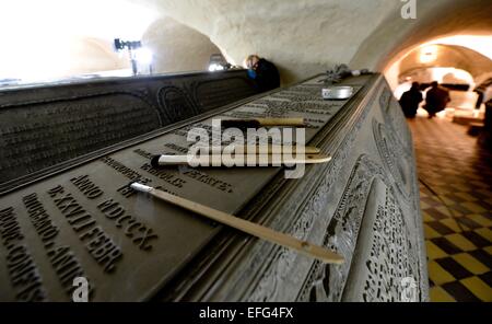 Wolfenbuettel, Germany. 19th Jan, 2015. A restorer works on the zinc coffin from the Welfen family in the princely crypt below the main church in Wolfenbuettel, Germany, 19 January 2015. In spring, all 28 coffins in the princely crypt will be restored. Over the course of the year, the crypt will open an exhibition for visitors. Photo: Peter Steffen/dpa/Alamy Live News Stock Photo