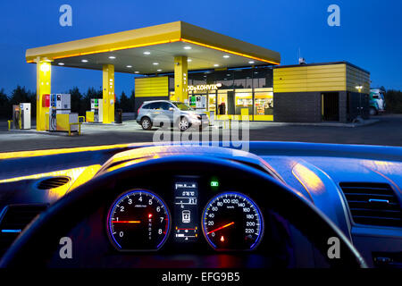 Car dashboard, instrument panel and speedometer, Electronic controls. Gas station. Stock Photo