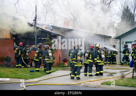Firefighters respond to a house fire in Boise, Idaho, USA. Stock Photo