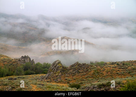 Fog blanketing the mountains along US 20 in Elmore County, Idaho, USA. Stock Photo