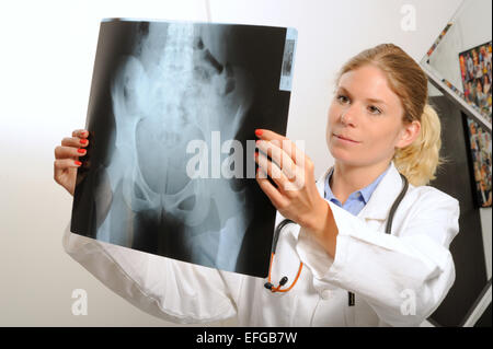 Female doctor examining an x-ray image Stock Photo